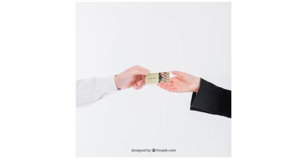 a pic of two hands exchanging business cards