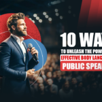 A Caucasian man standing before an audience with a mic in his hand and a confident body language, ready to deliver a speech